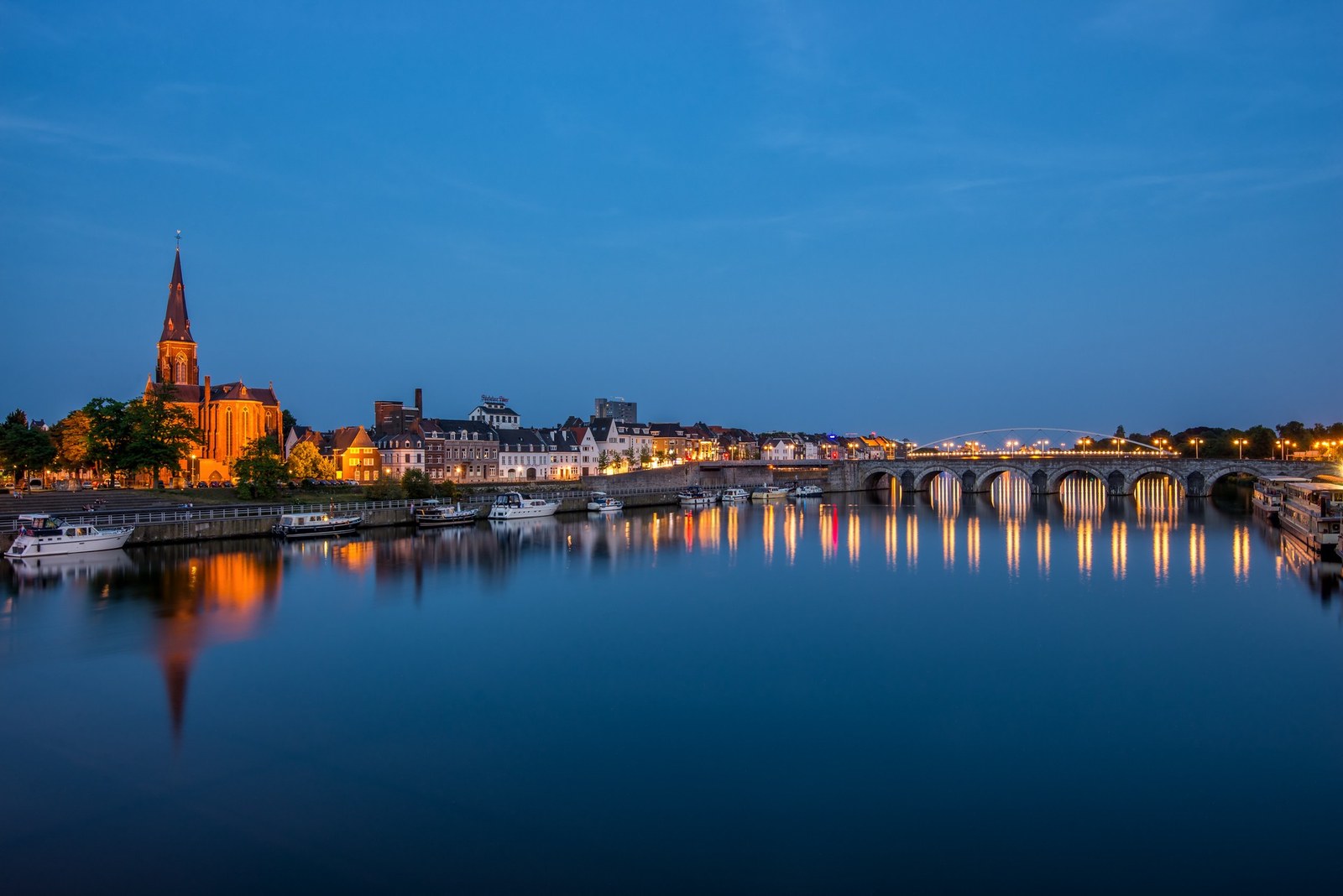 Maastricht reflected in the River Meuse at dusk.